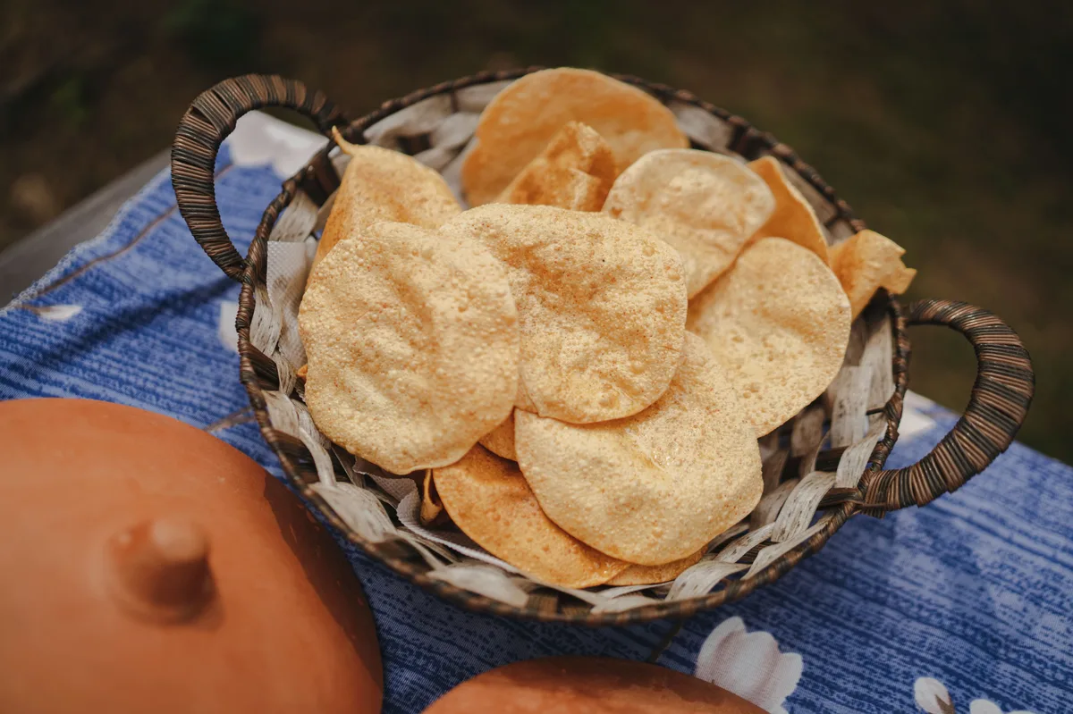 Crisp papadums in a woven basket