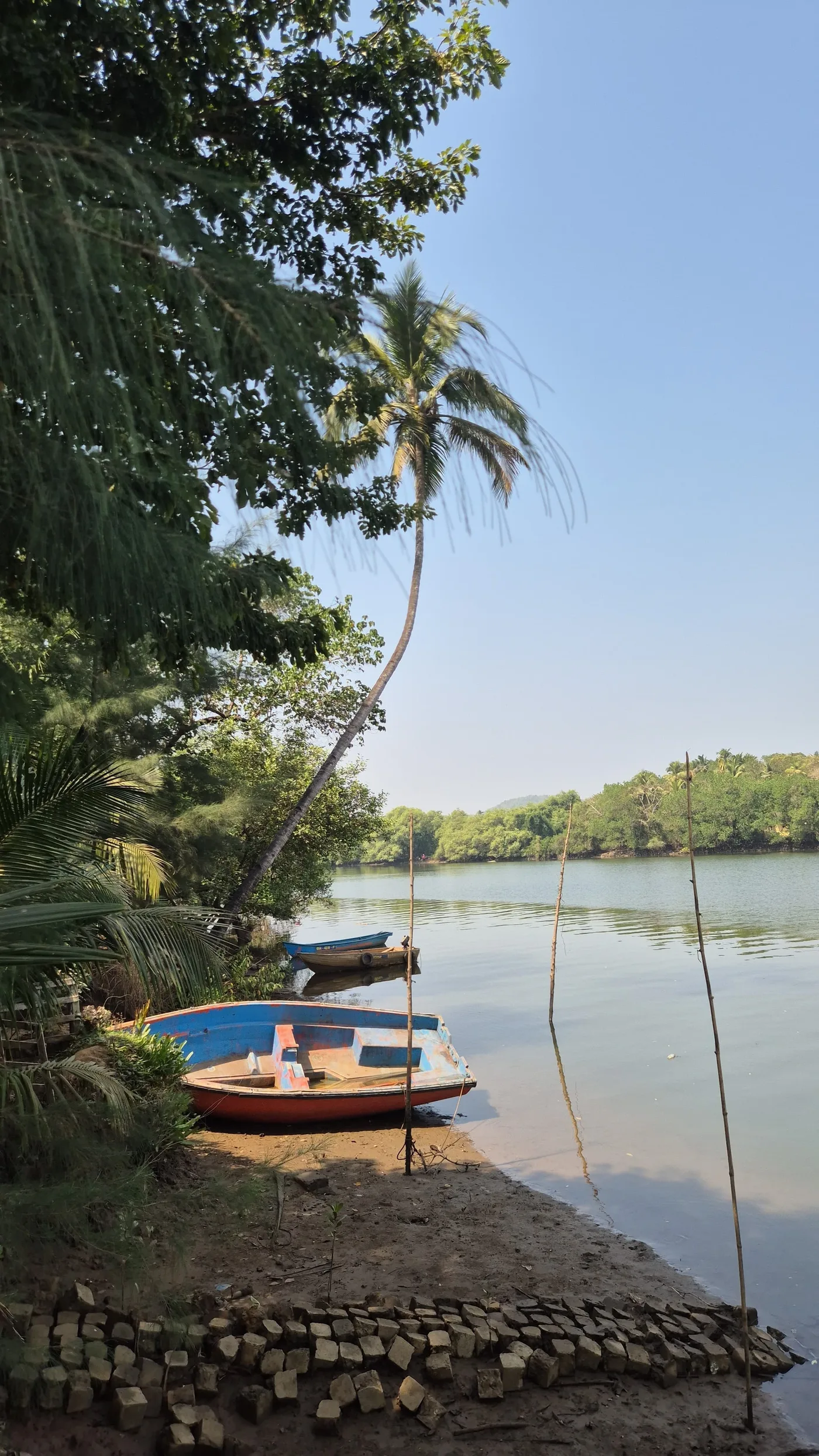 Fishing boats moored on the riverbank at sunrise