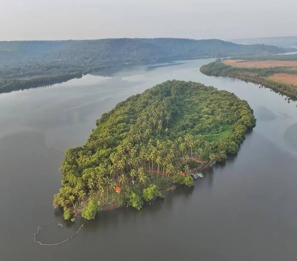 Aerial view of Sai Island from above, surrounded by the river